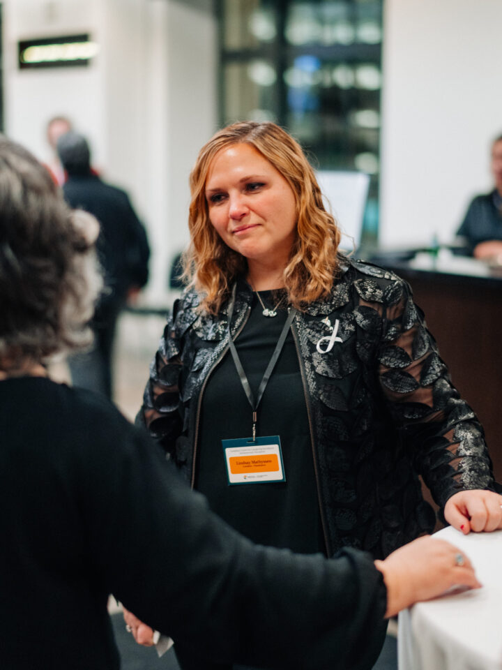 MP Lindsay Mathyssen speaking with an attendee