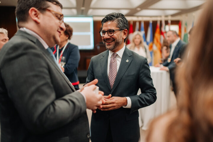 MP Yasir Naqvi speaks with an attendee