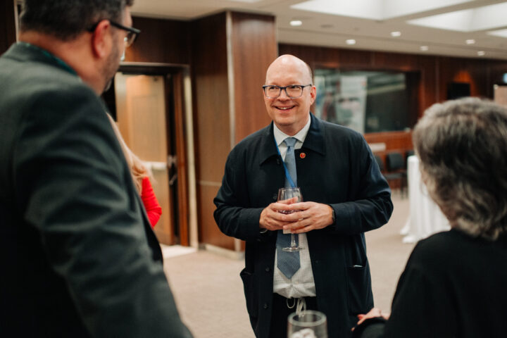 Senator Kristopher Wells speaking with CCCE’s James Janeiro and Lorin MacDonald