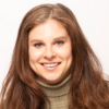 A smiling white woman with light brown hair, head shot of Irina Voronin