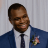 Smiling black man wearing a blue suit