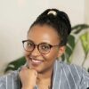 Smiling Black woman wearing glasses. Portrait of Noella Muribora.